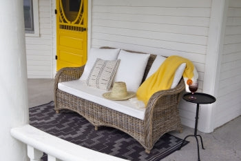 Rattan Katrina couch ANCHORED IN MUSKOKA